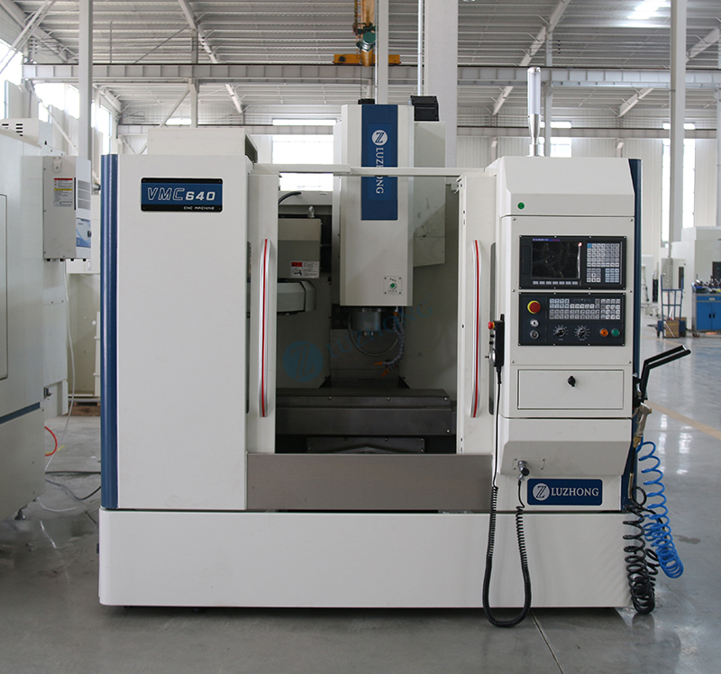How should commonly used components of a vertical machining center be maintained on a routine basis?